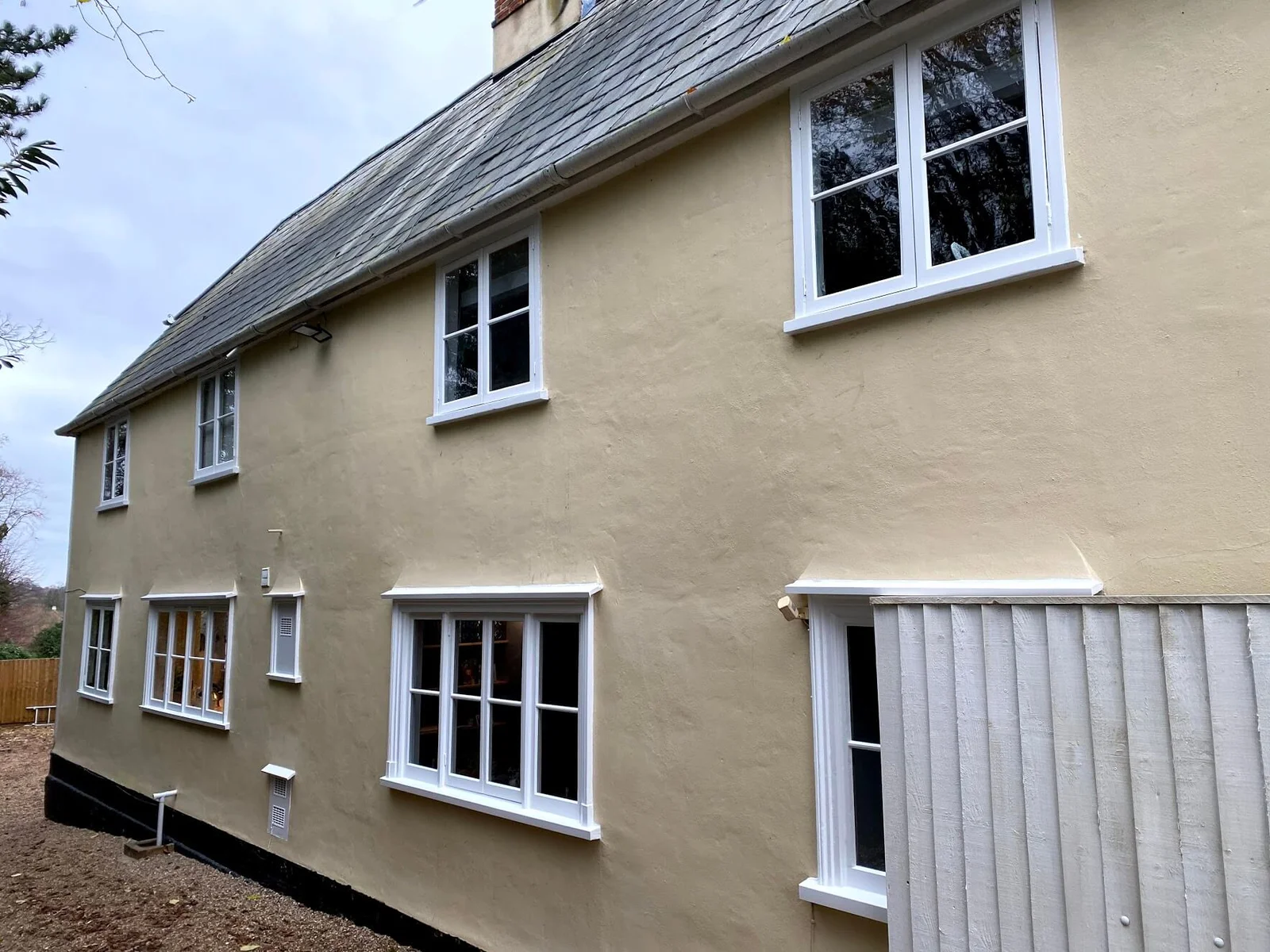 Completed sash window restoration on a brick façade