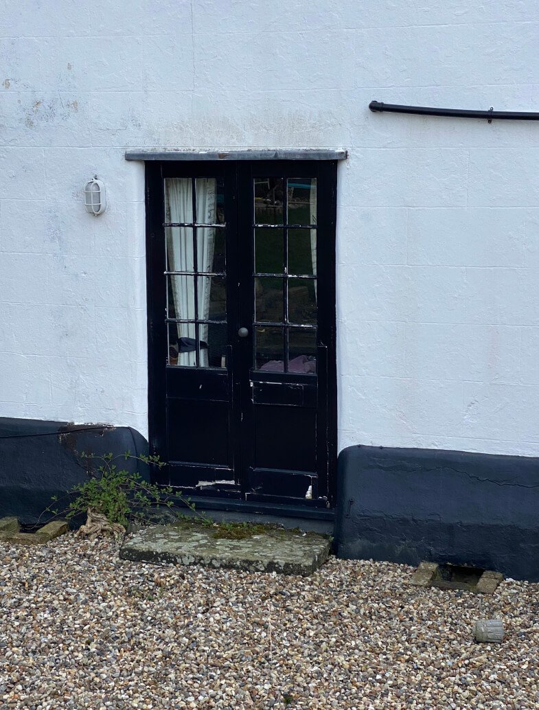 original wooden cottage doors before renovation